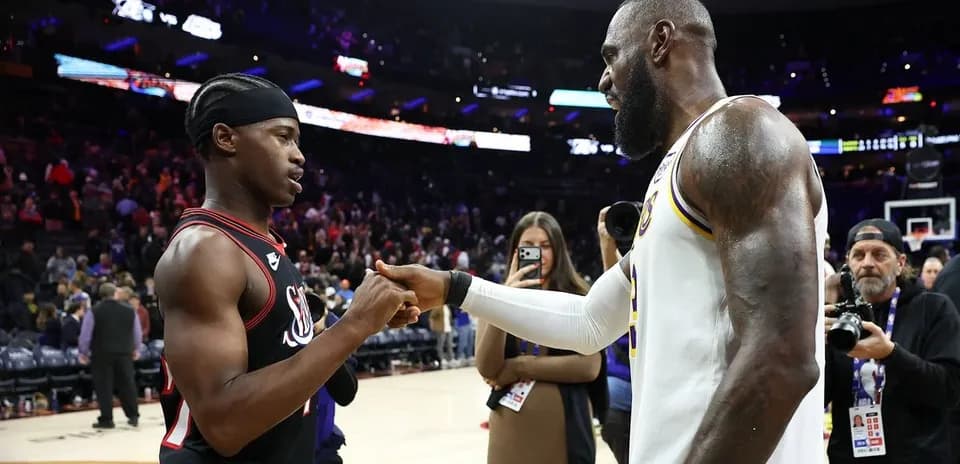 Two basketball players shaking hands post-game