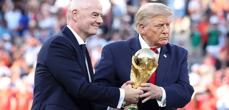 Gianni Infantino and Donald Trump with World Cup trophy