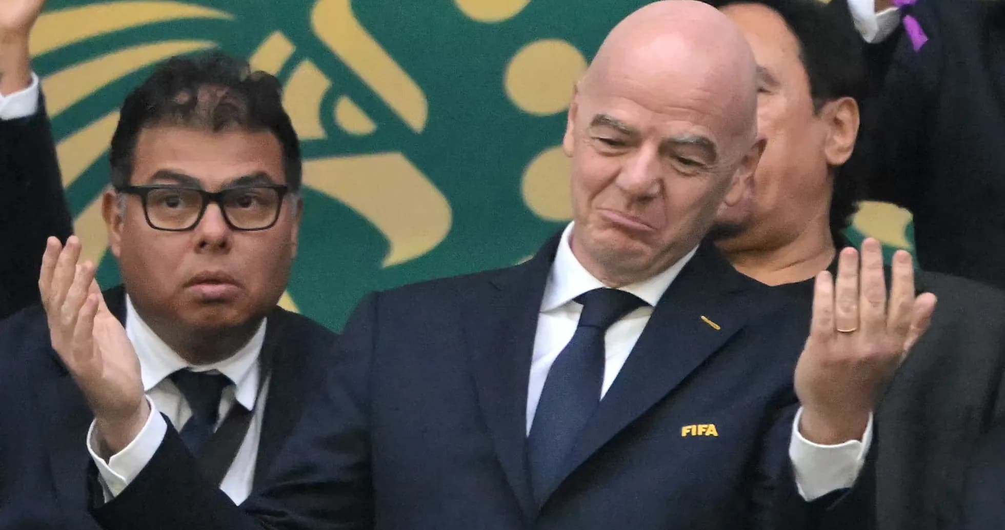FIFA officials at a sporting event expressing reactions