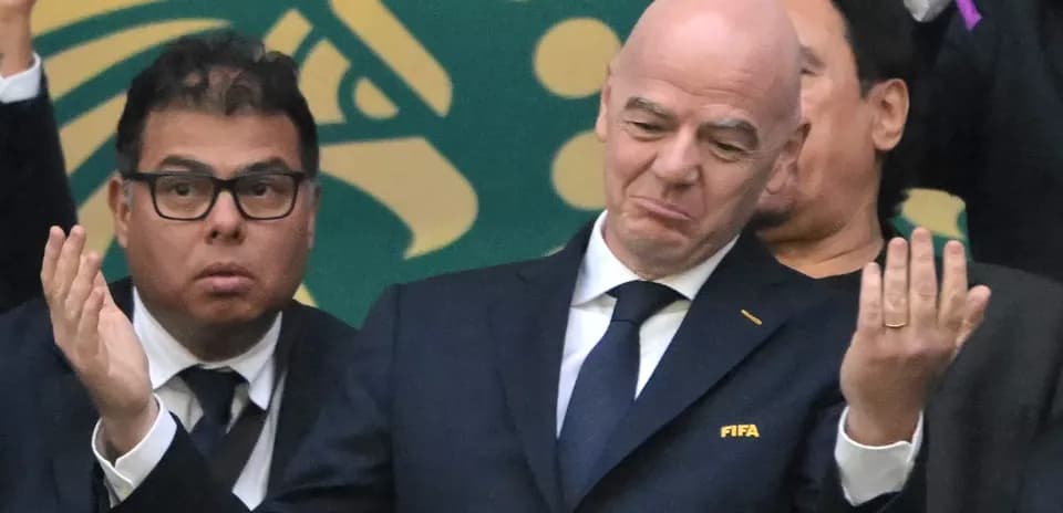 FIFA officials at a sporting event expressing reactions