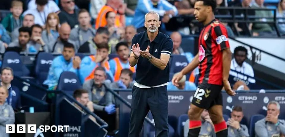 Bournemouth coach directing player during match at stadium