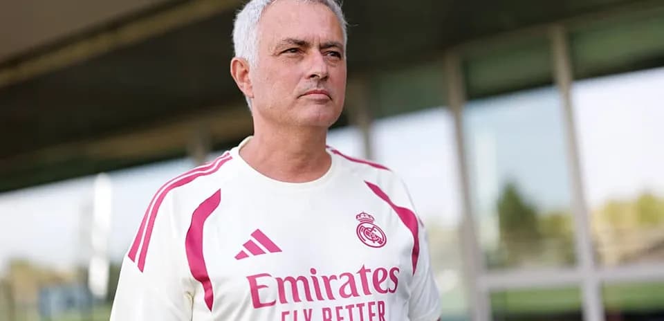 Mourinho wearing Real Madrid training kit outdoors