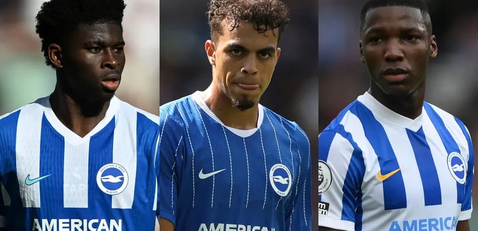 Three Brighton players in team jerseys during match