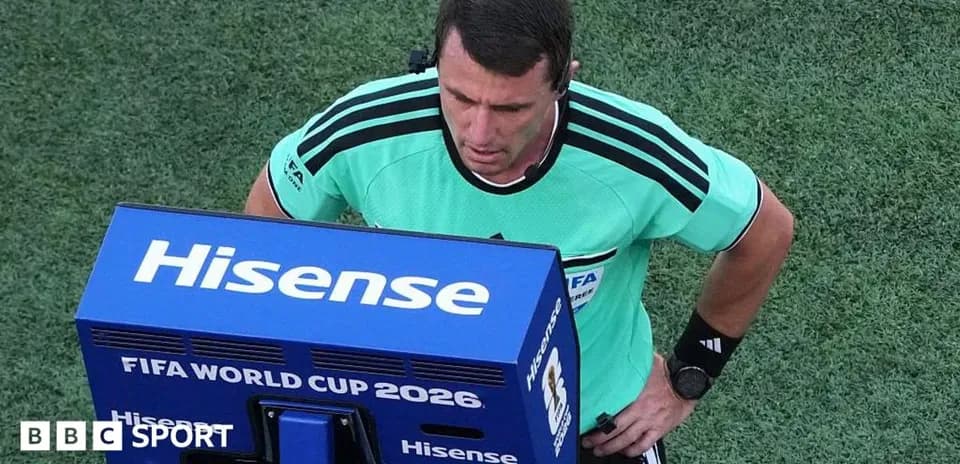 Referee reviewing a decision on VAR monitor