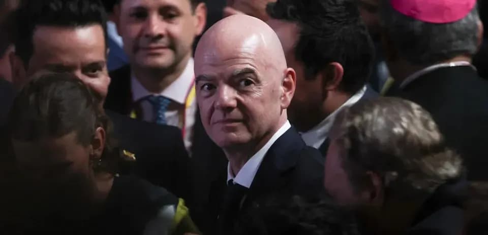 FIFA president surrounded by crowd at event