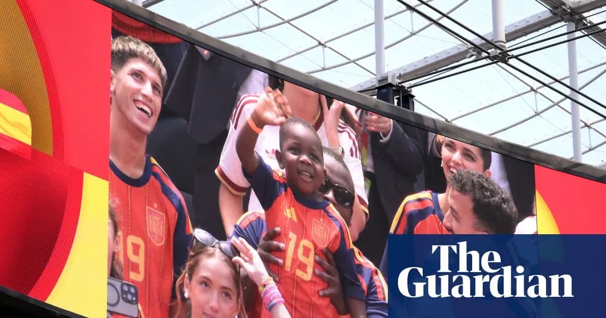 Fans celebrating with a child in Spain jersey