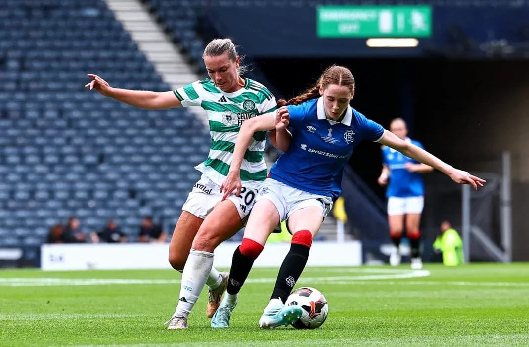 Celtic and Rangers players contesting for the ball