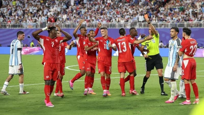 Swiss players celebrating after a foul call