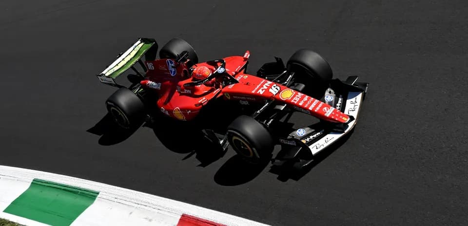 Ferrari car racing on track with Italian flag colors