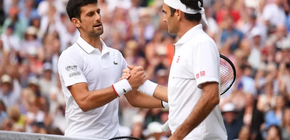 Novak Djokovic and Roger Federer shaking hands at Wimbledon