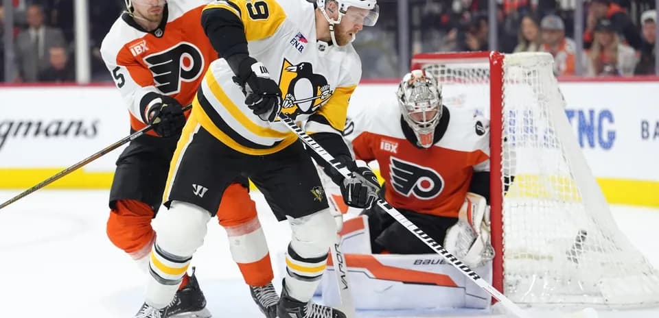 Hockey players competing for the puck in game