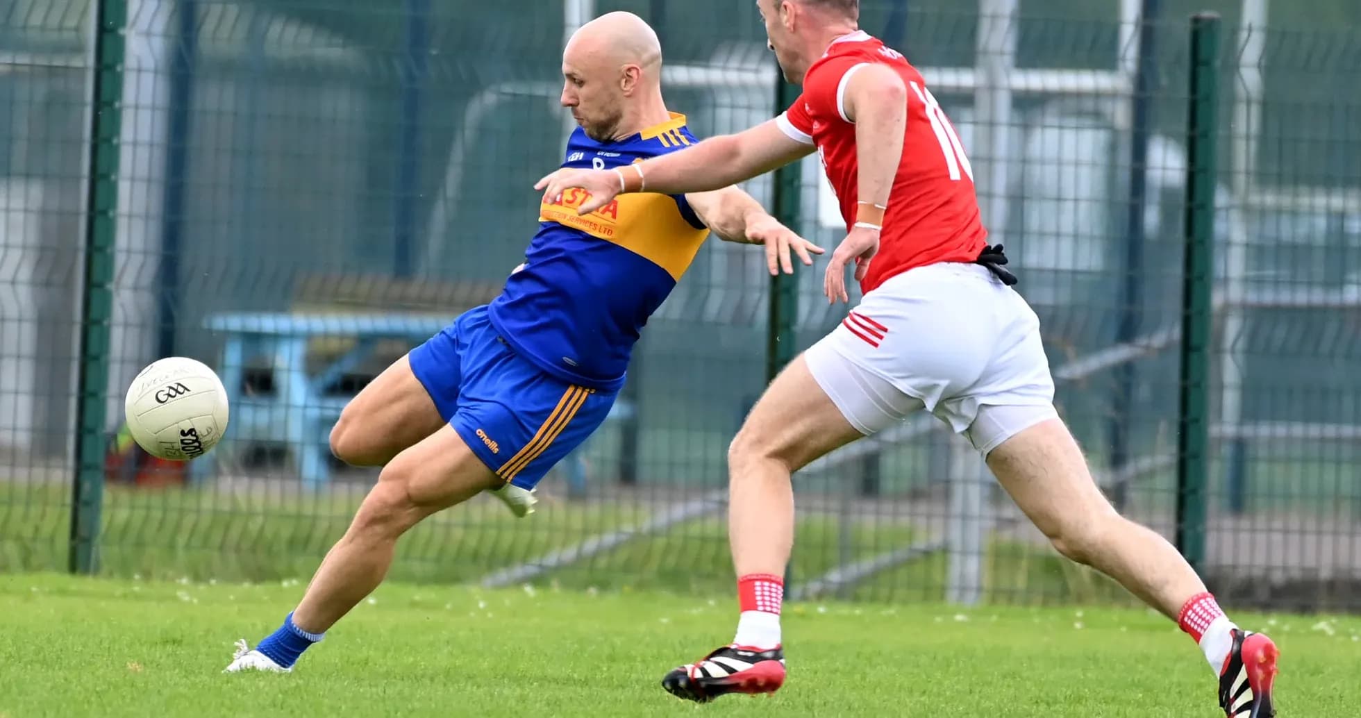Two players competing for the ball on field
