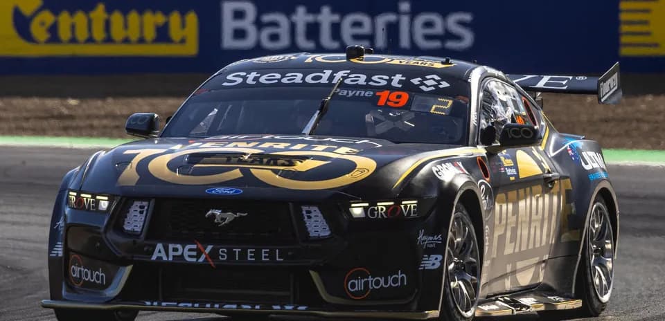 Ford Mustang racing car on track during competition