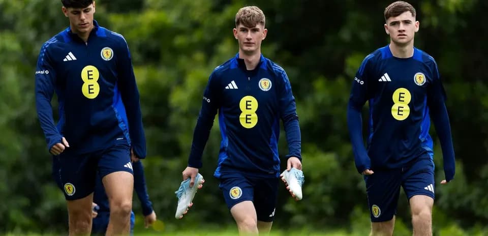 Three players walking during training session