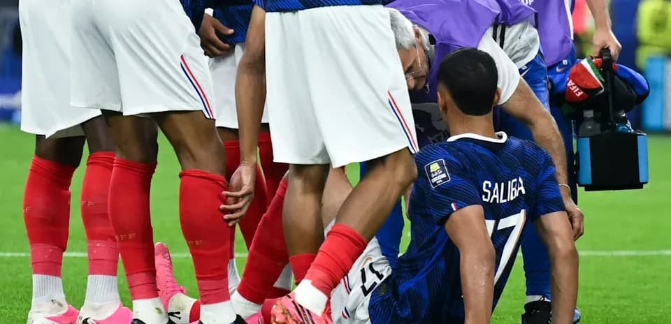 French players attending to injured teammate Saliba