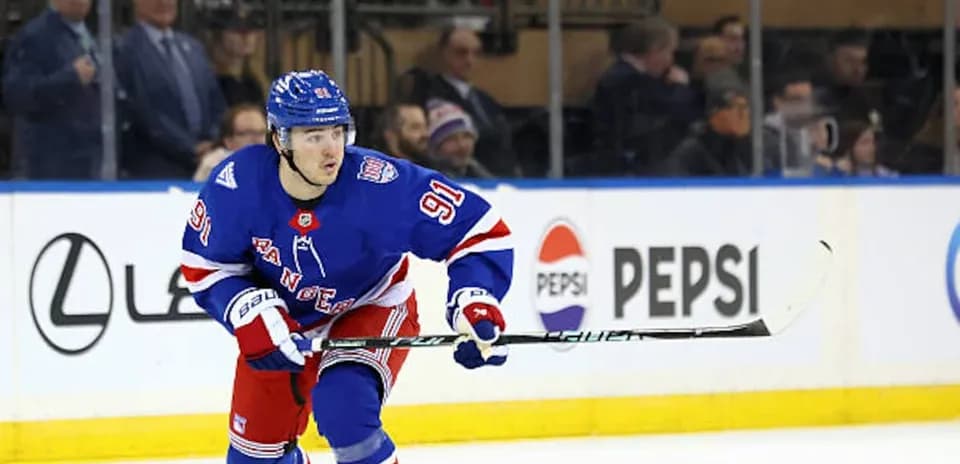 Hockey player skating on ice during match