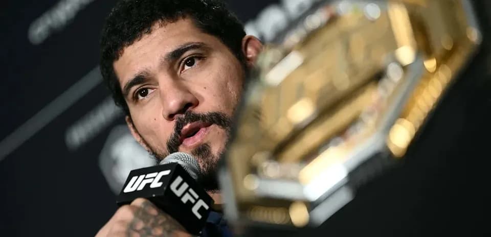 UFC fighter speaking into microphone at press conference