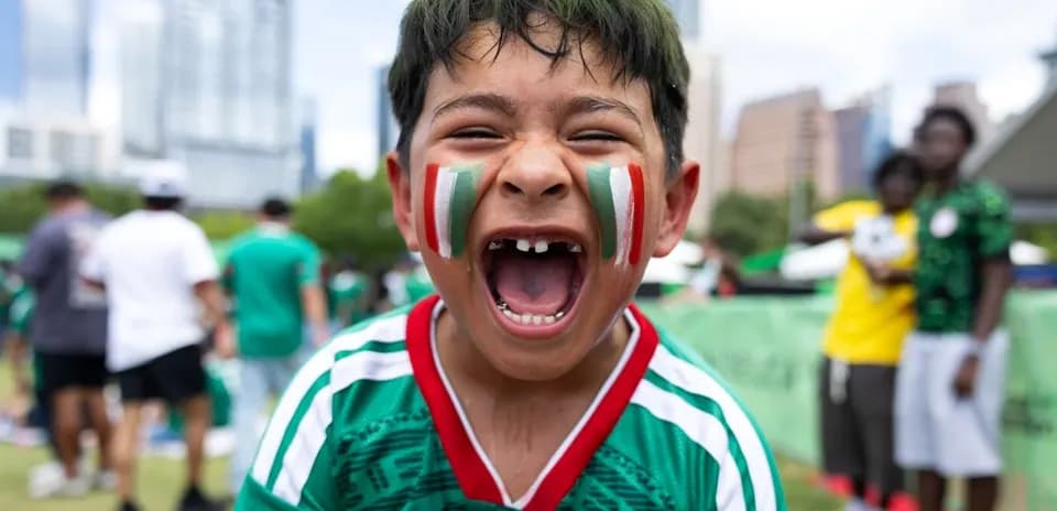Boys celebrating in Mexico national team jersey