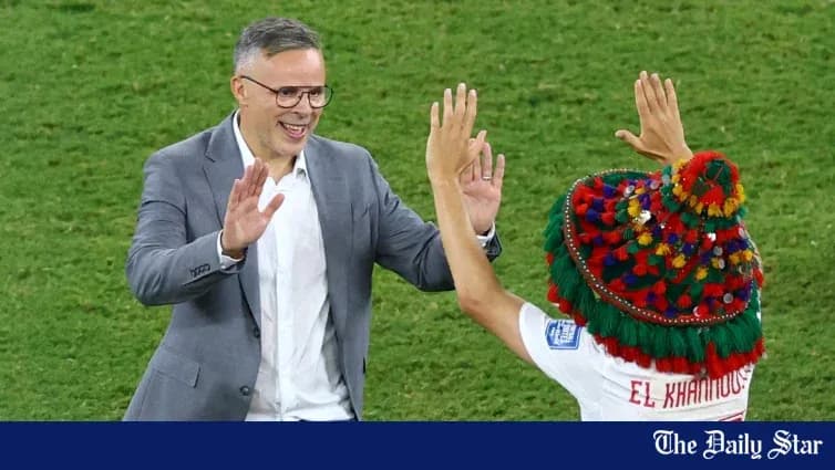 Coach and player celebrating on the field