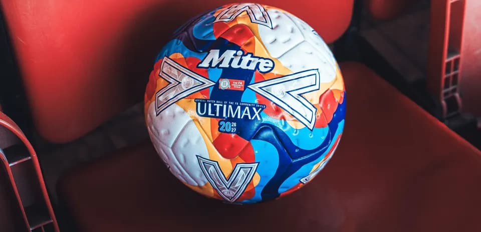 Mitre Ultimax football resting on stadium seat