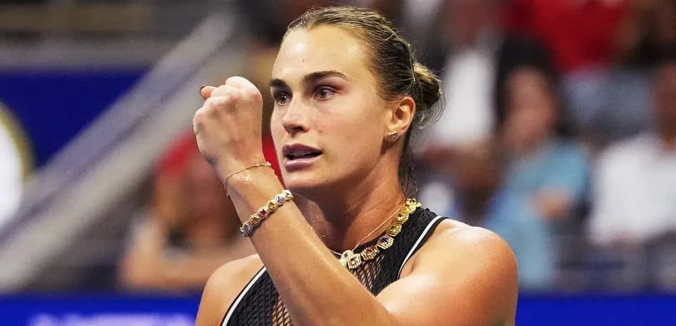 Tennis player celebrating after a point during match