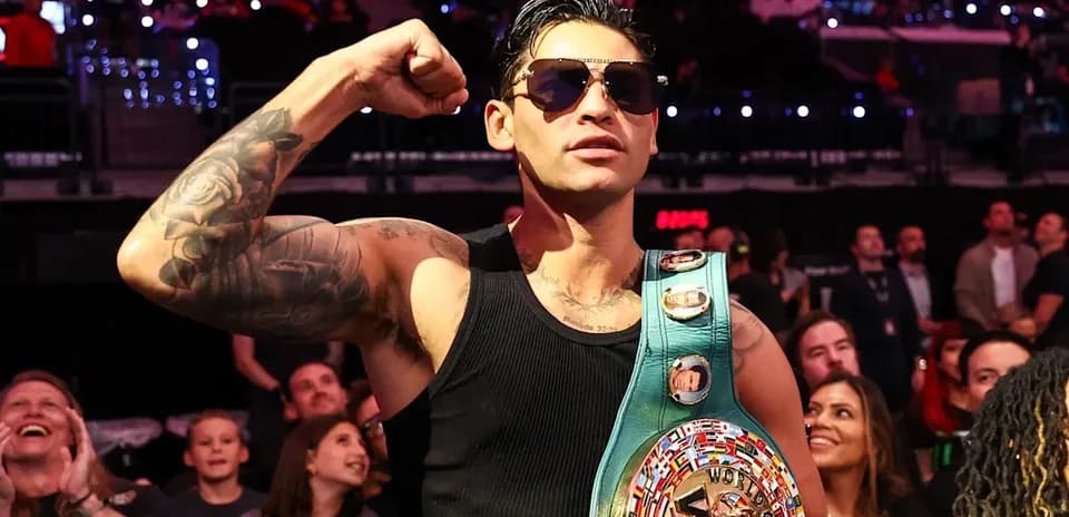 Boxer celebrating with championship belt in audience