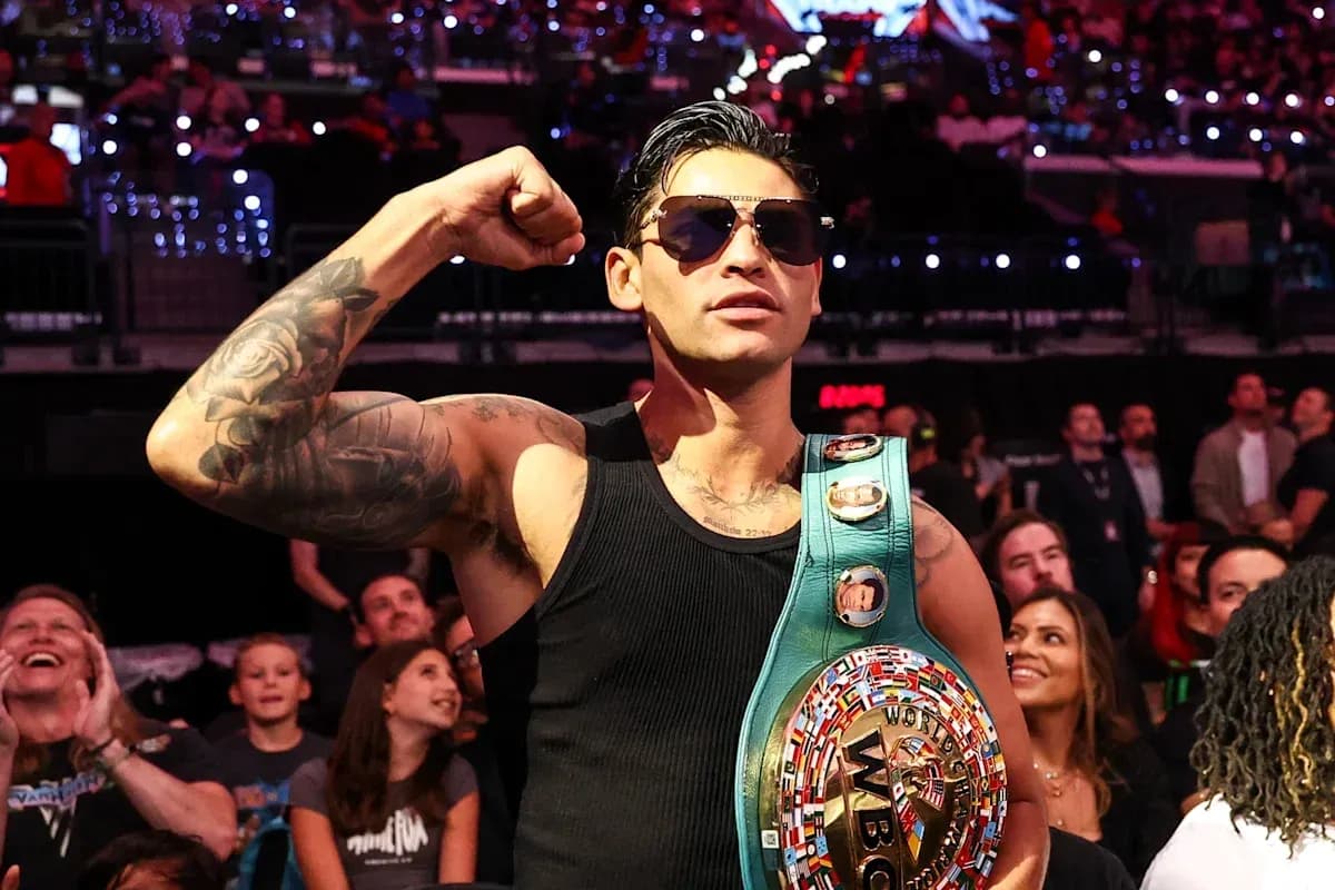 Boxer celebrating with championship belt in audience