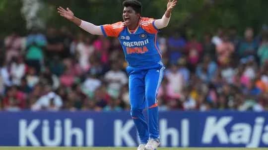 Bowler appealing during cricket match in blue uniform