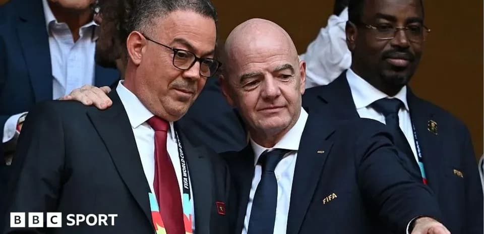 Two officials discussing at a FIFA event