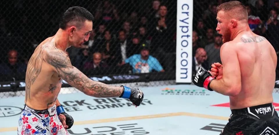 Two fighters engaging in a match inside the octagon