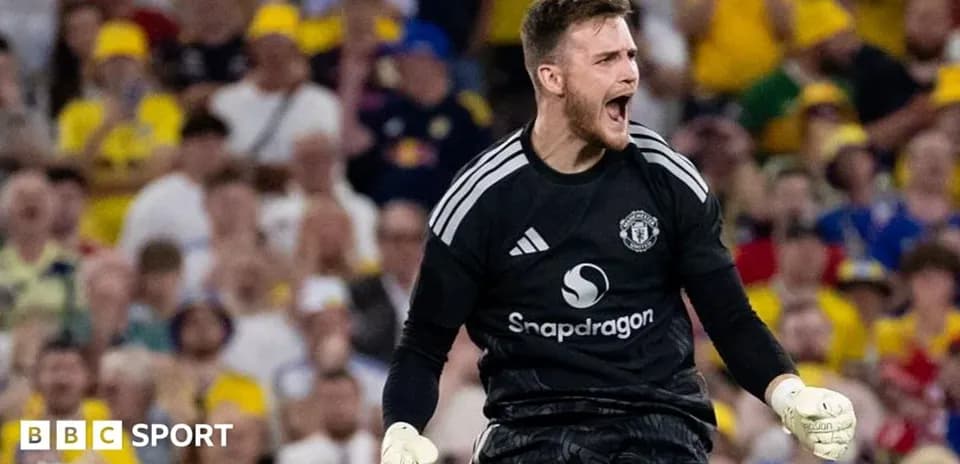 Goalkeeper celebrating during a match with fans in background