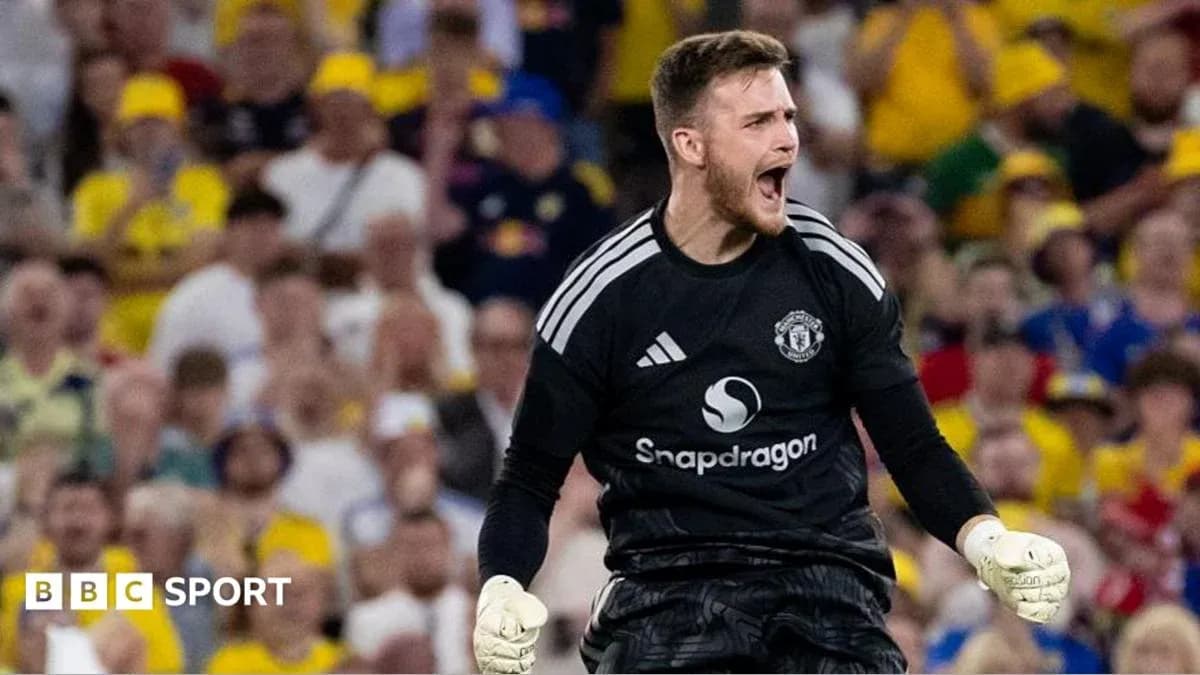 Goalkeeper celebrating during a match with fans in background