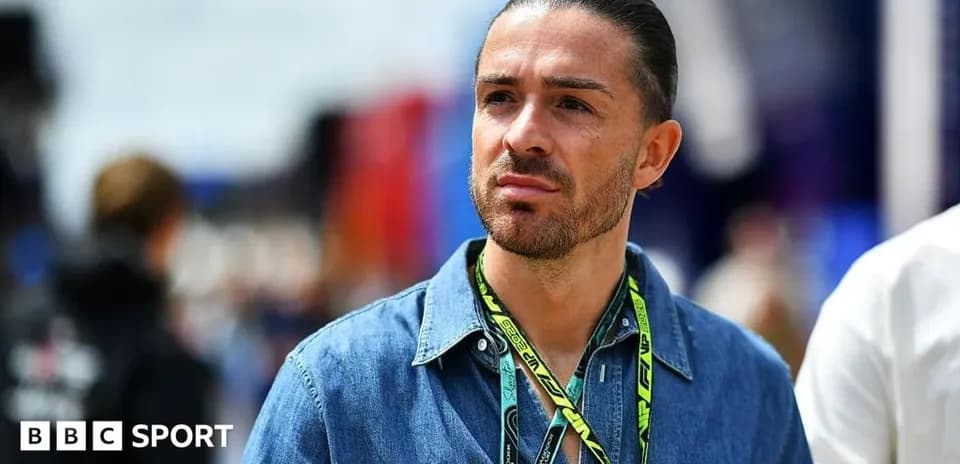 Man in denim shirt at motorsport event