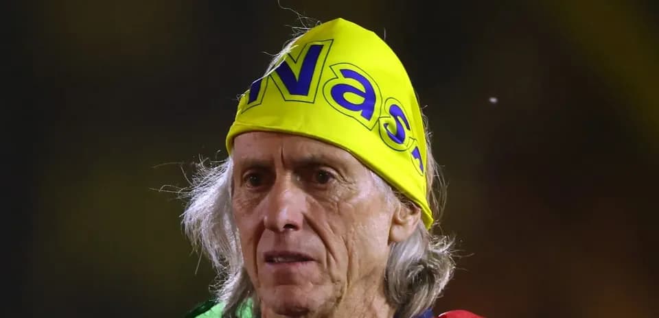 Older man wearing a yellow bandana at event