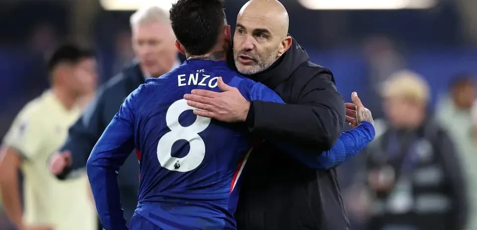 Enzo hugs coach after the match
