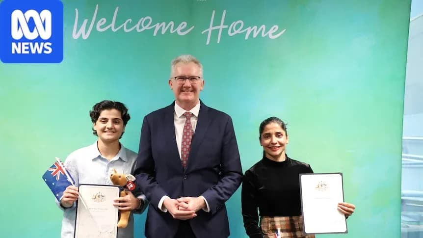 Two individuals receiving citizenship certificates with official
