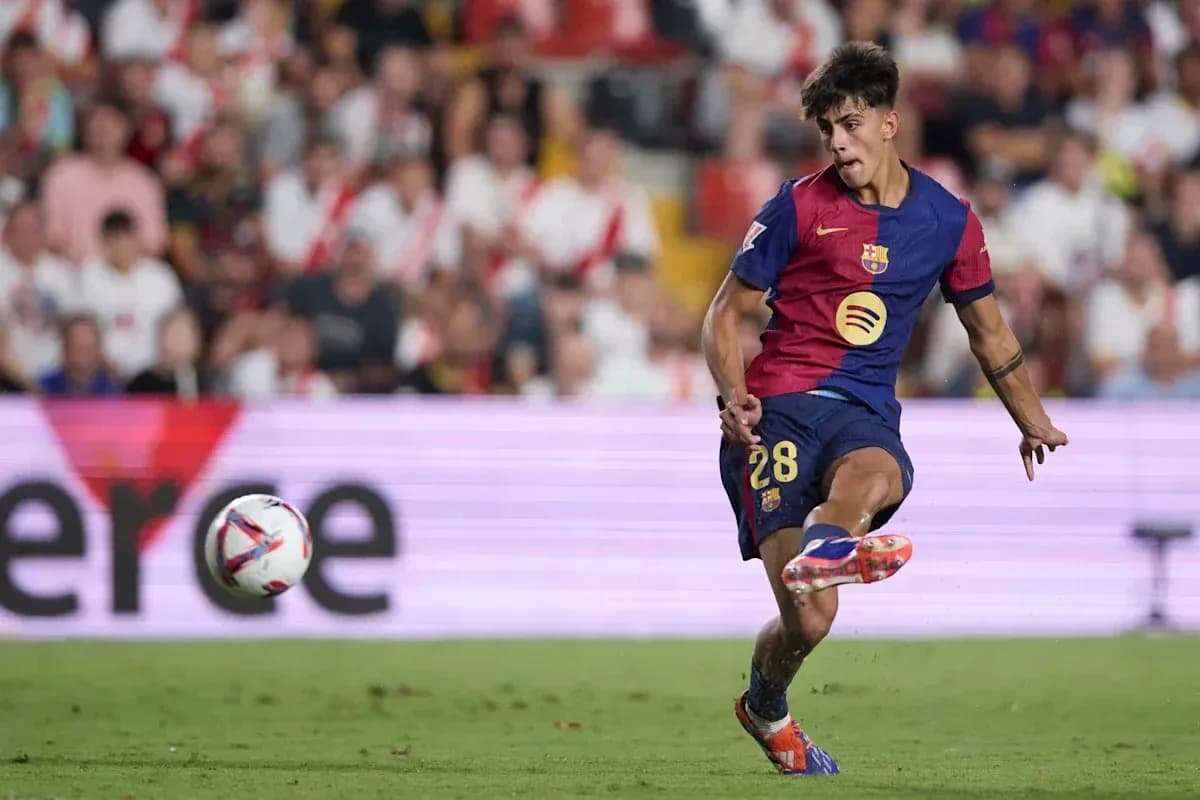 Barcelona player kicking the ball during match