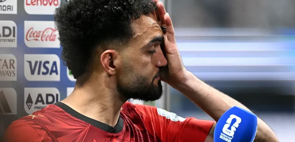 Player speaking into microphone after match