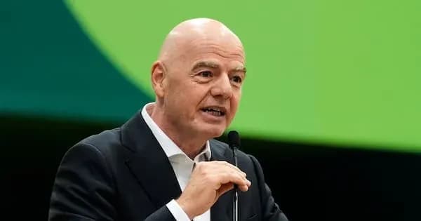 FIFA president speaking at event podium