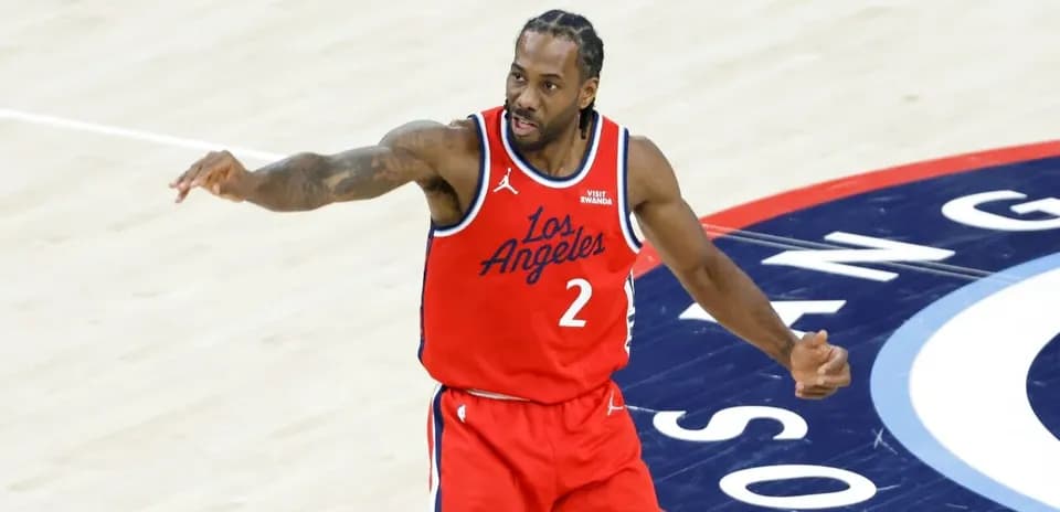 Basketball player gesturing on court during game