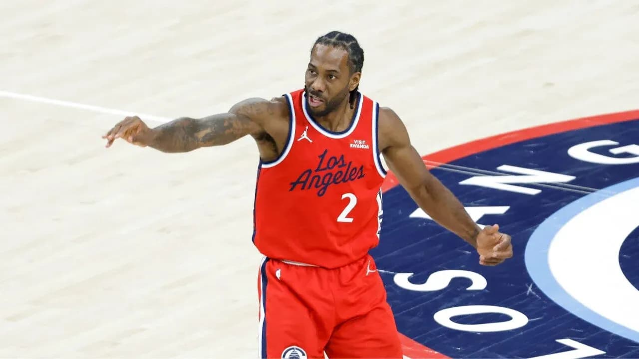 Basketball player gesturing on court during game