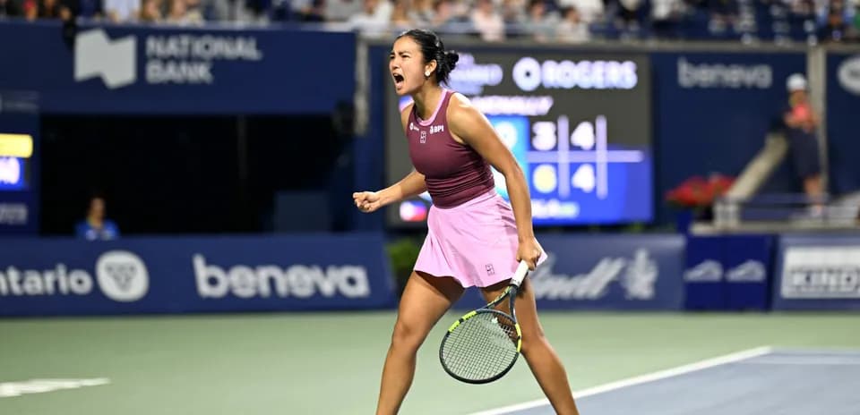 Tennis player celebrating a point during match
