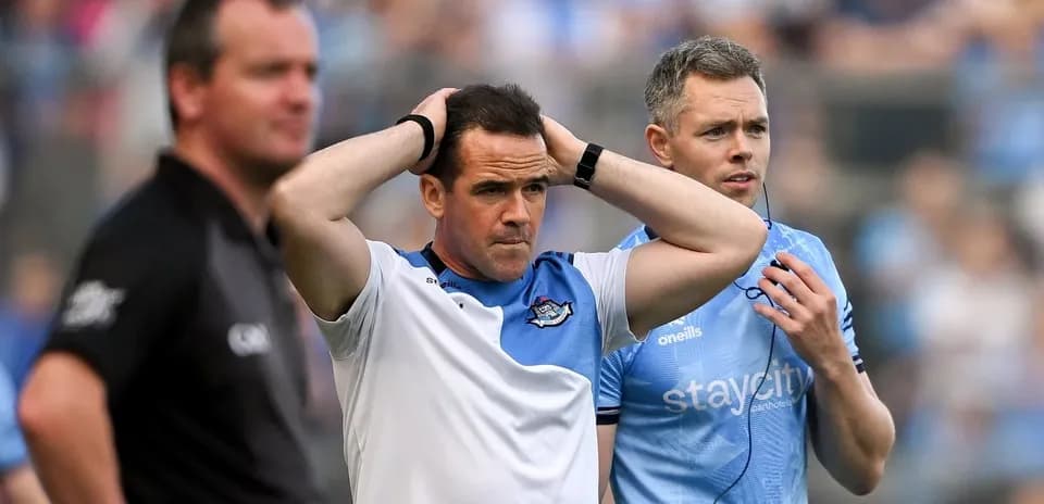 Coaches discussing during a tense moment in match