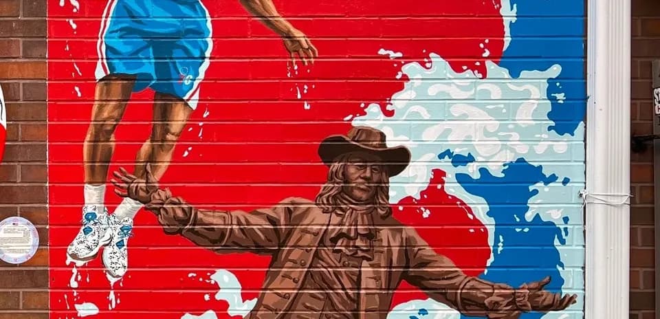 Mural of basketball player and historical figure
