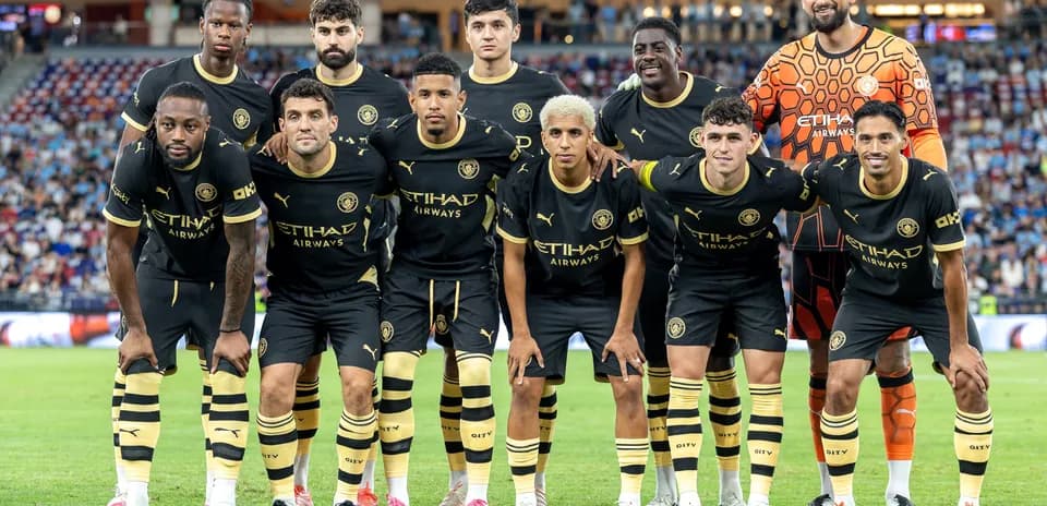 Manchester City players posing for team photo