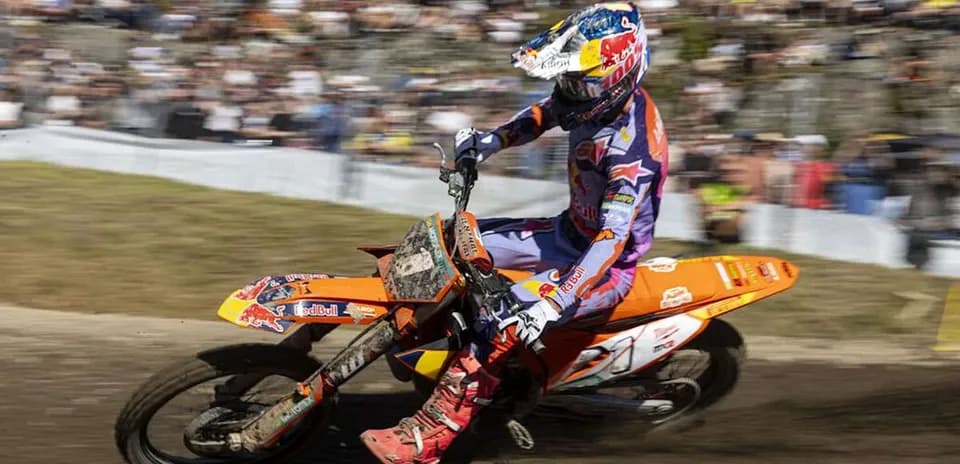 Motocross rider racing on a dirt track