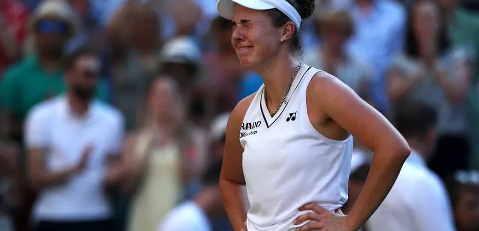 Tennis player reacting during a match at Wimbledon