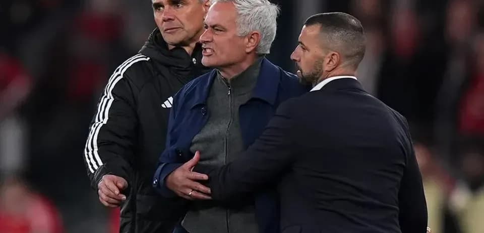 Trainers restraining coach during heated moment