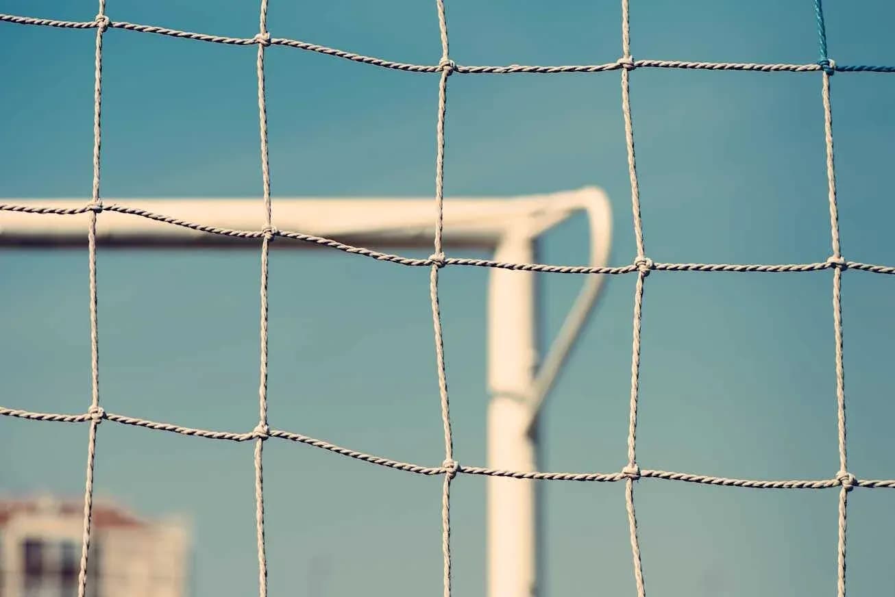 Football goal net with blue sky background