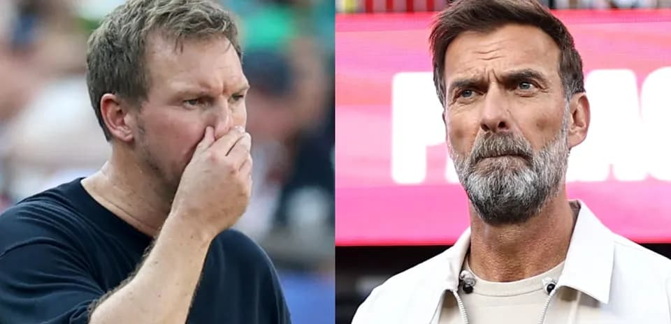 Two coaches observing the match with concern